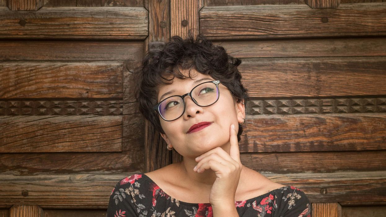 woman leaning against door