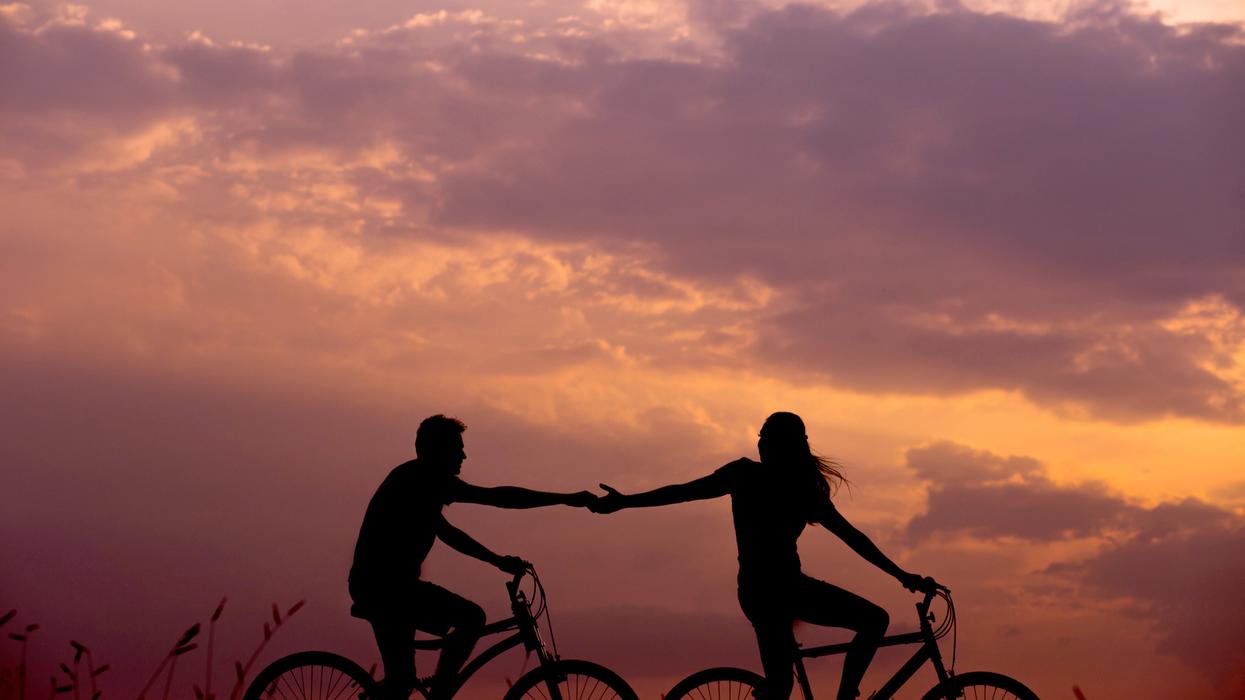 Woman letting go of boyfriend's hand