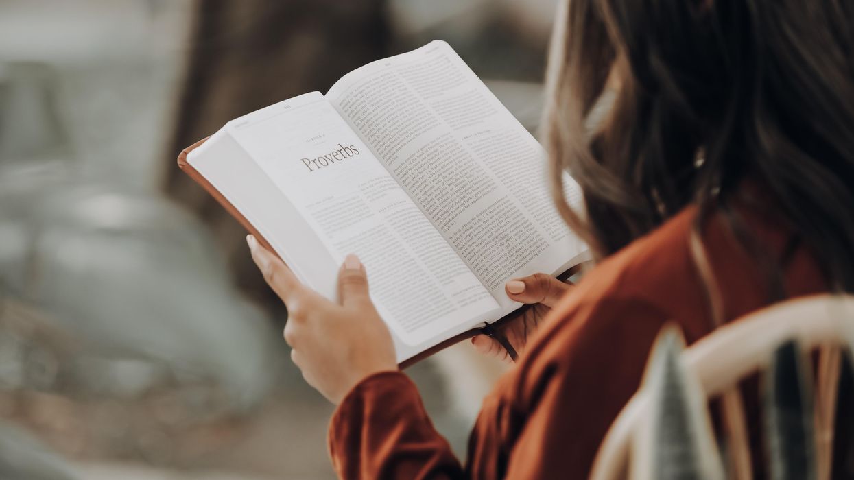 Woman looking at Bible