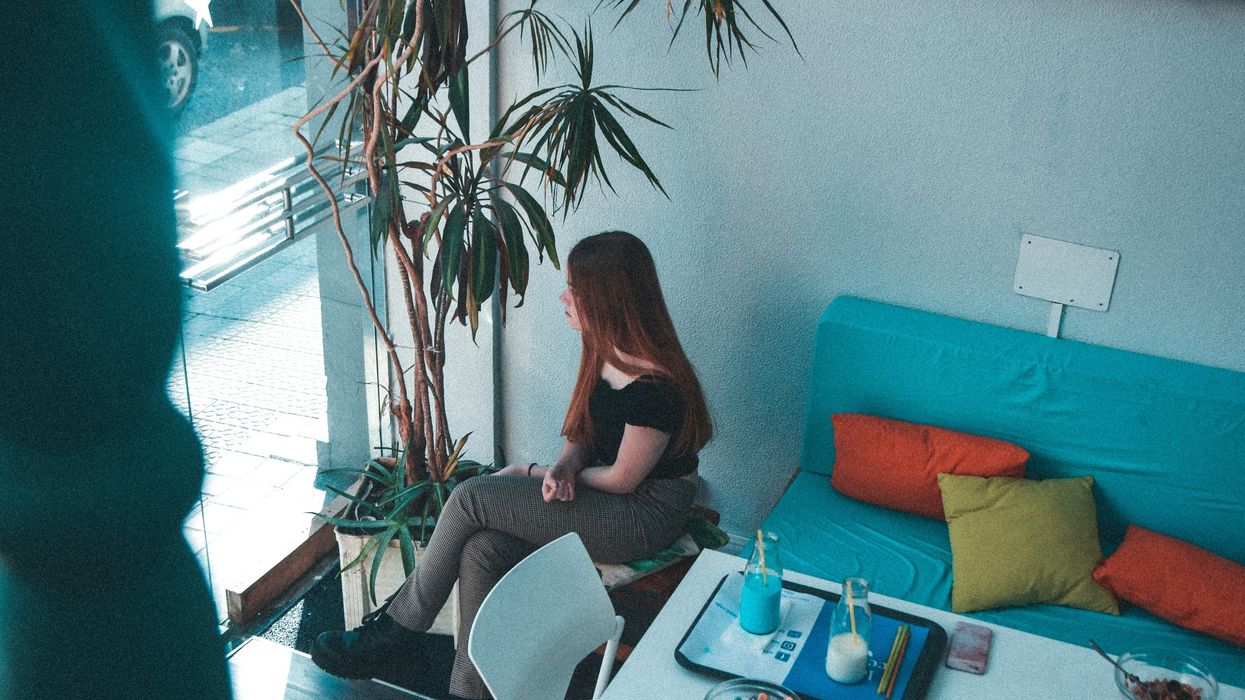 Woman looking out window