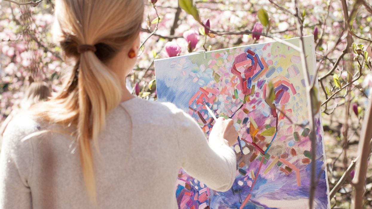 Woman painting a floral portrait