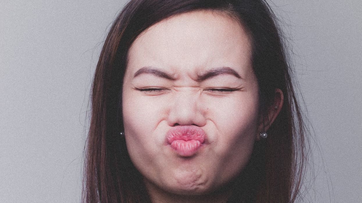 Woman puckering after hearing something inappropriate