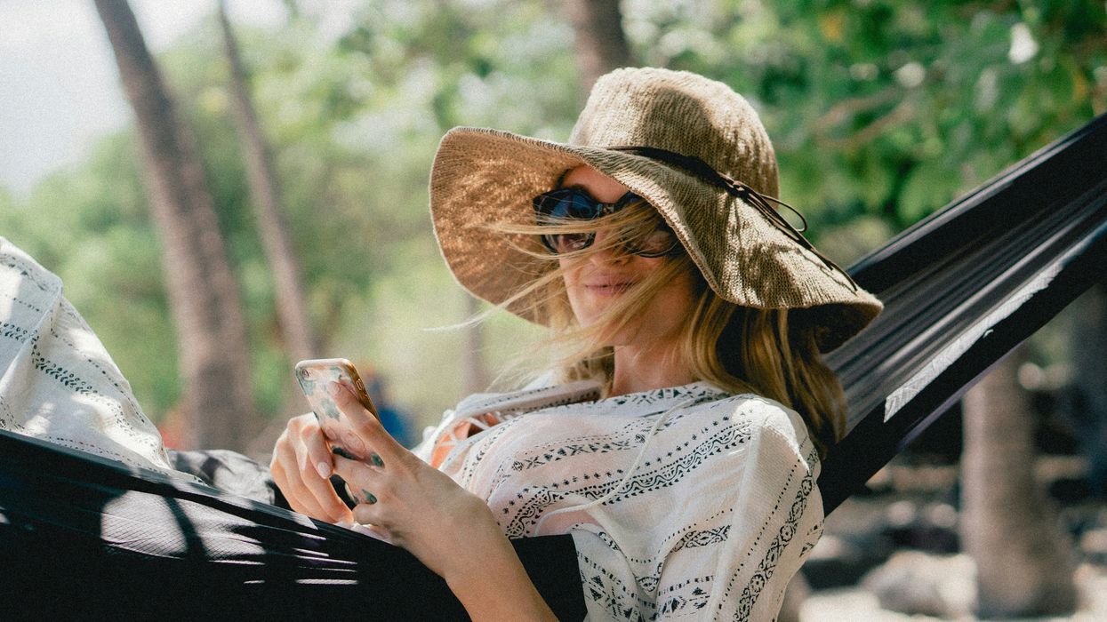 Woman relaxing in sunhat and sunglasses