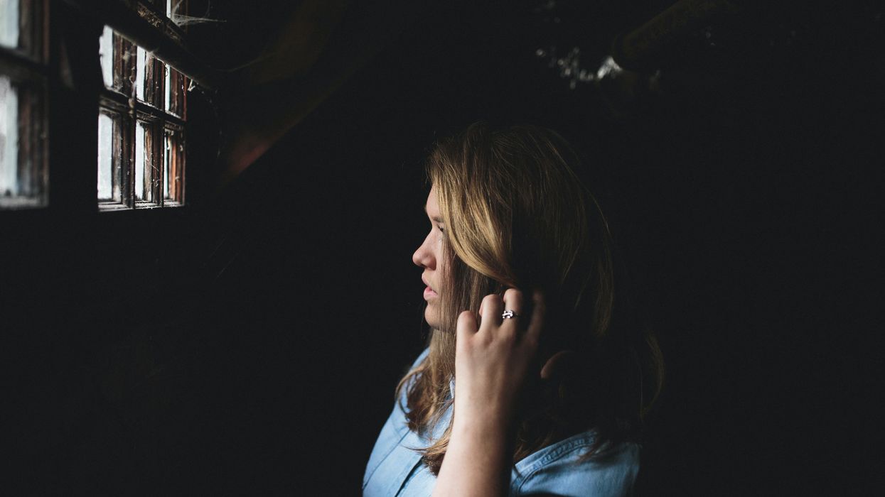 Woman scratching head