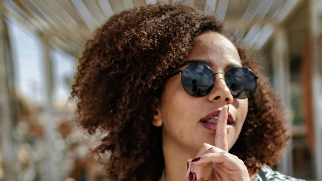 Woman shushing someone