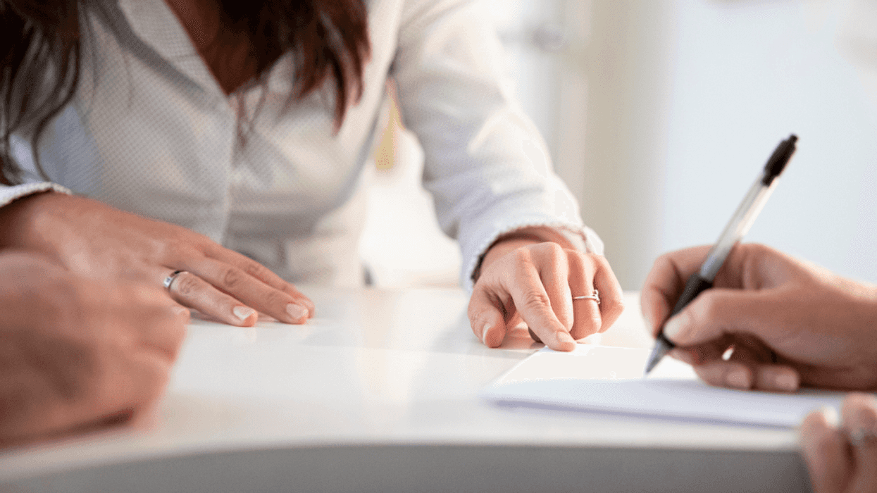 Woman signing a contract