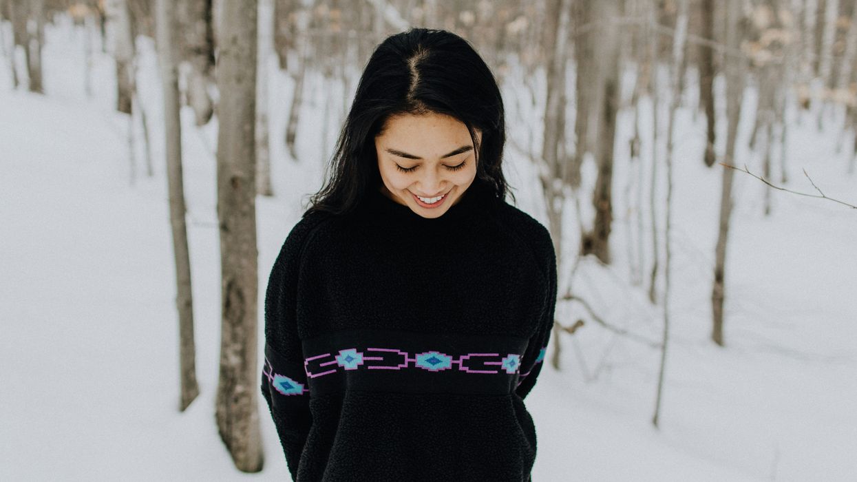 Woman smiling and appearing bashful