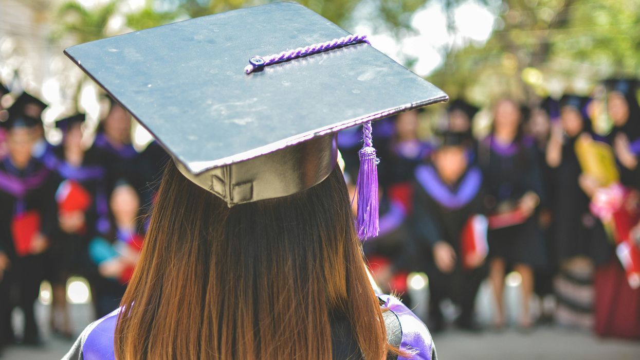 woman wearing academic cap and gown
