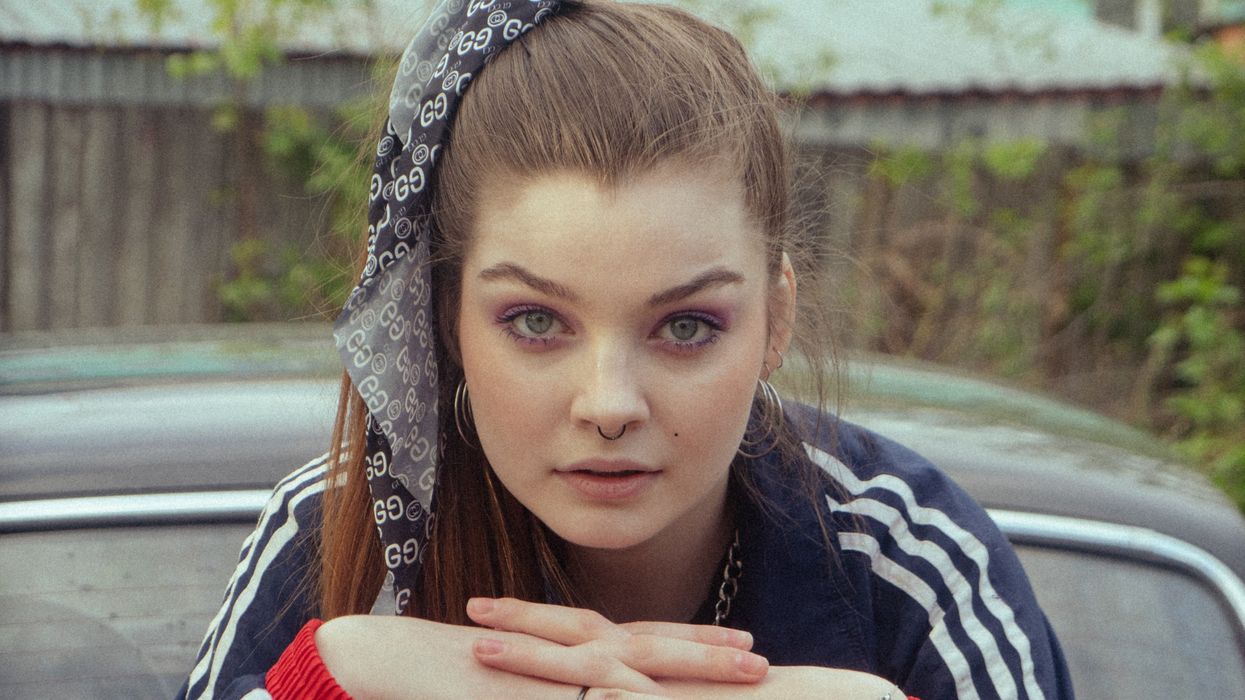 Woman with 90s side ponytail and makeup