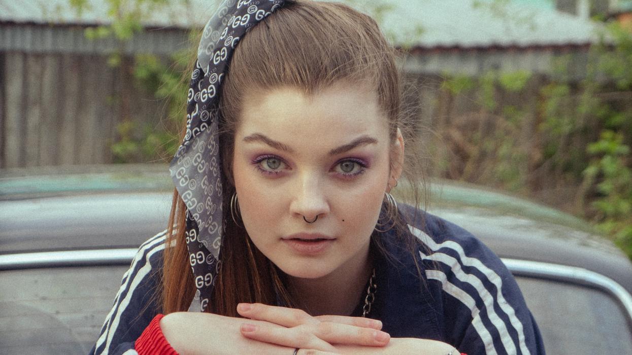 Woman with 90s side ponytail and makeup
