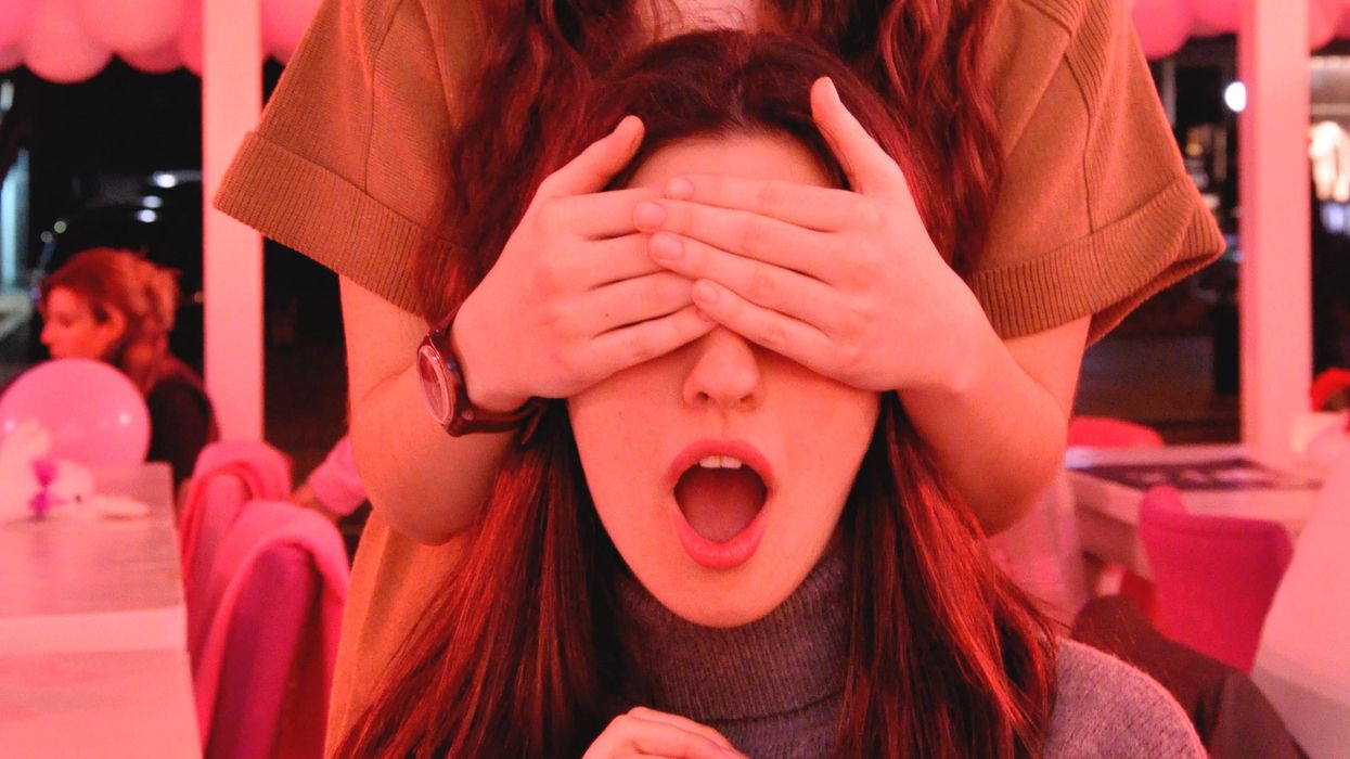 Woman with her eyes covered