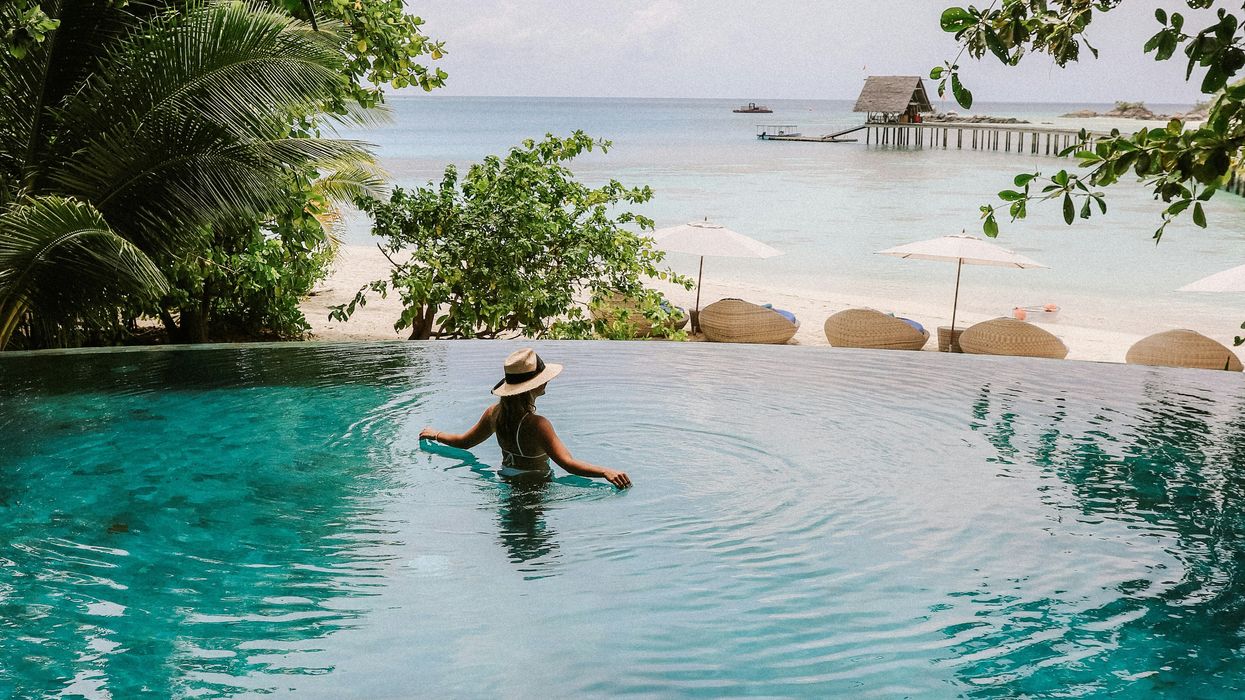 Women in infinity pool at ocean resort