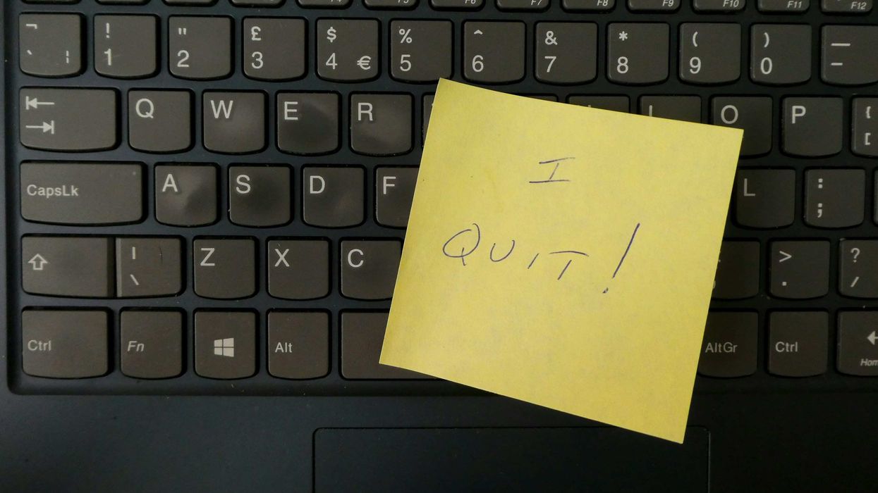 yellow note with "I QUIT!" on keyboard