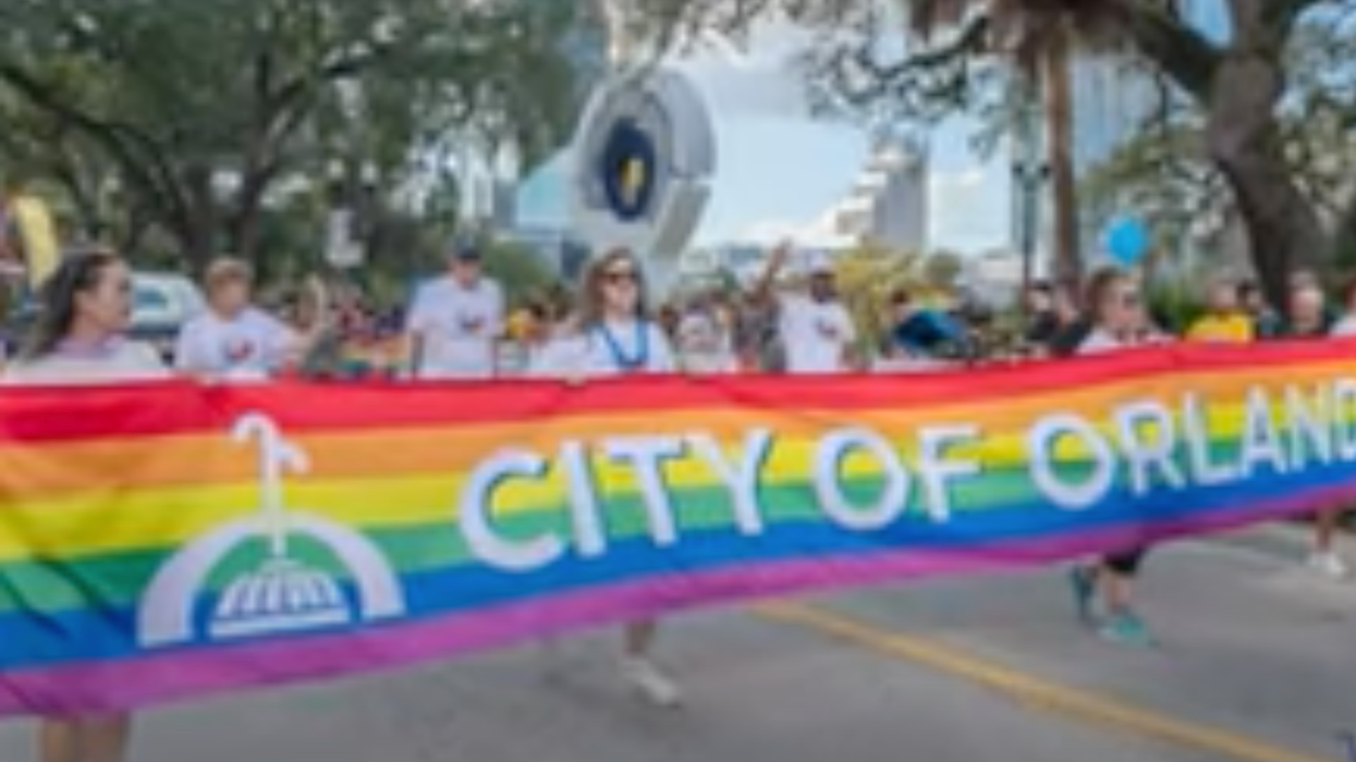 YouTube screenshot of demonstrators with Orlando Pride banner